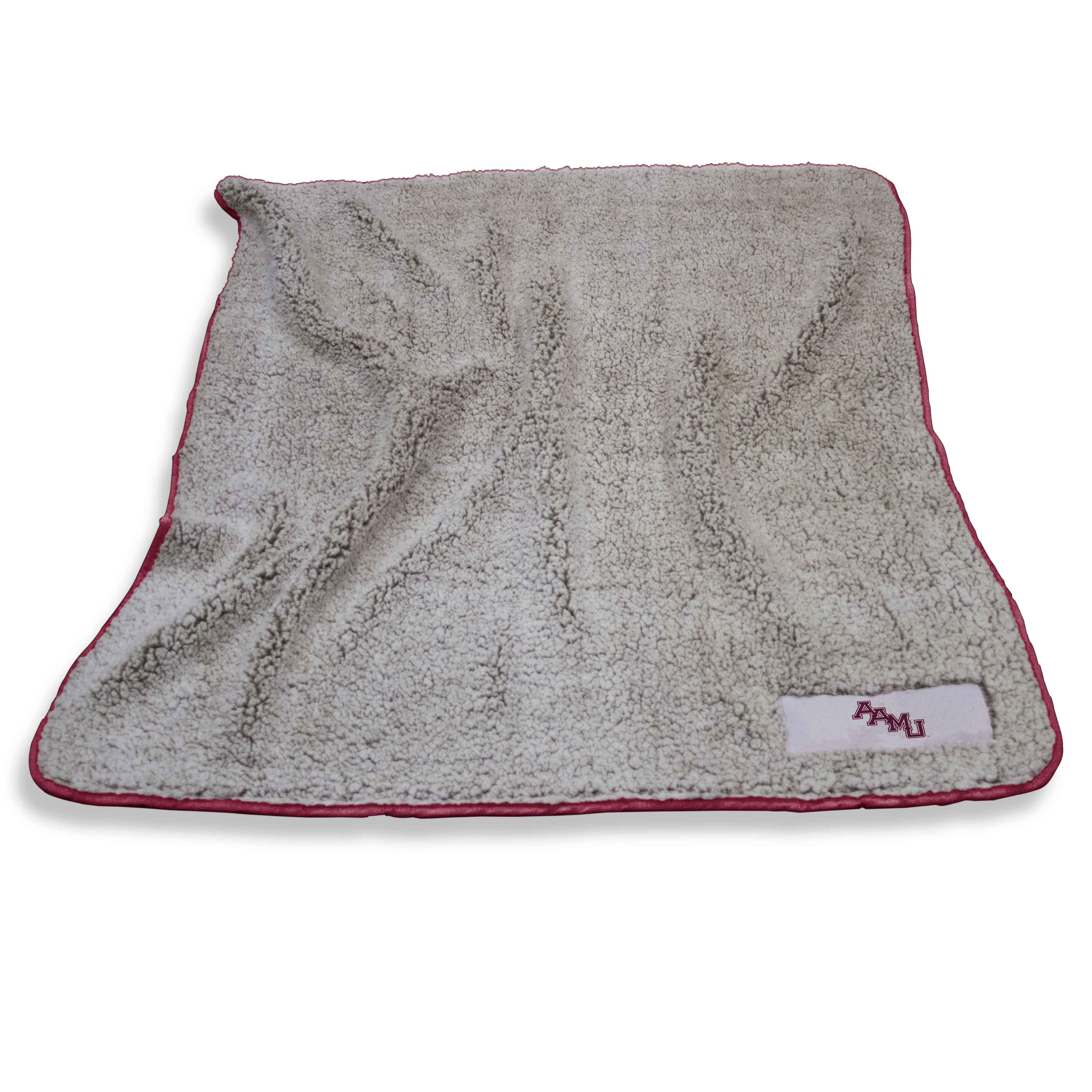 The Alabama A&M Frosty Fleece Throw is a top-selling, cozy blanket made of high-pile sherpa material. It features a team logo patch, is machine washable, and ideal for various settings. Perfect for gifts, it measures 50x60 and comes with a lifetime guarantee.