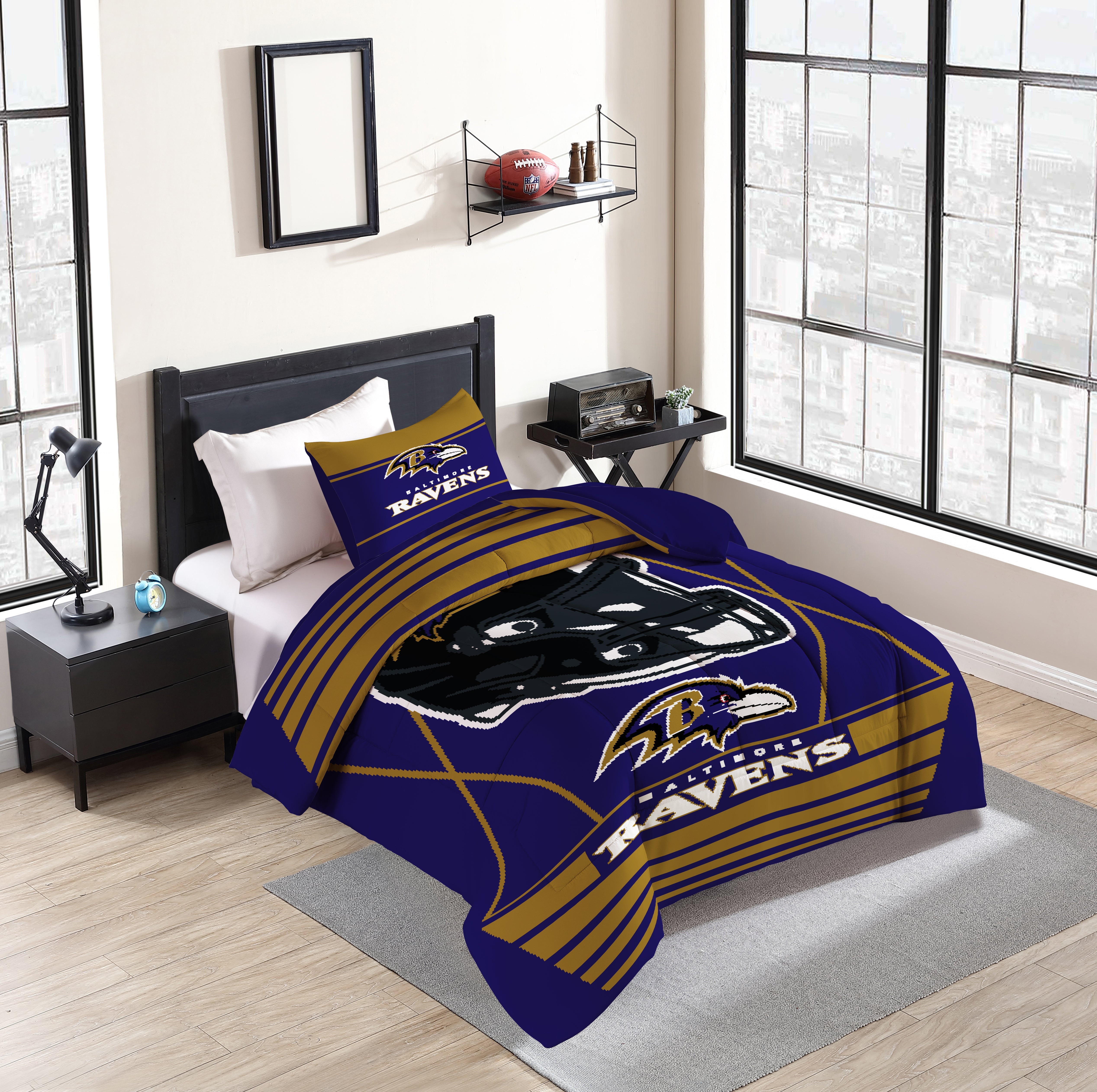 Baltimore Ravens Crosser Twin/Twin XL Comforter Set with vibrant team graphics, perfect for avid fans. Ideal for adding team pride and style to your bedroom while ensuring comfort all season.