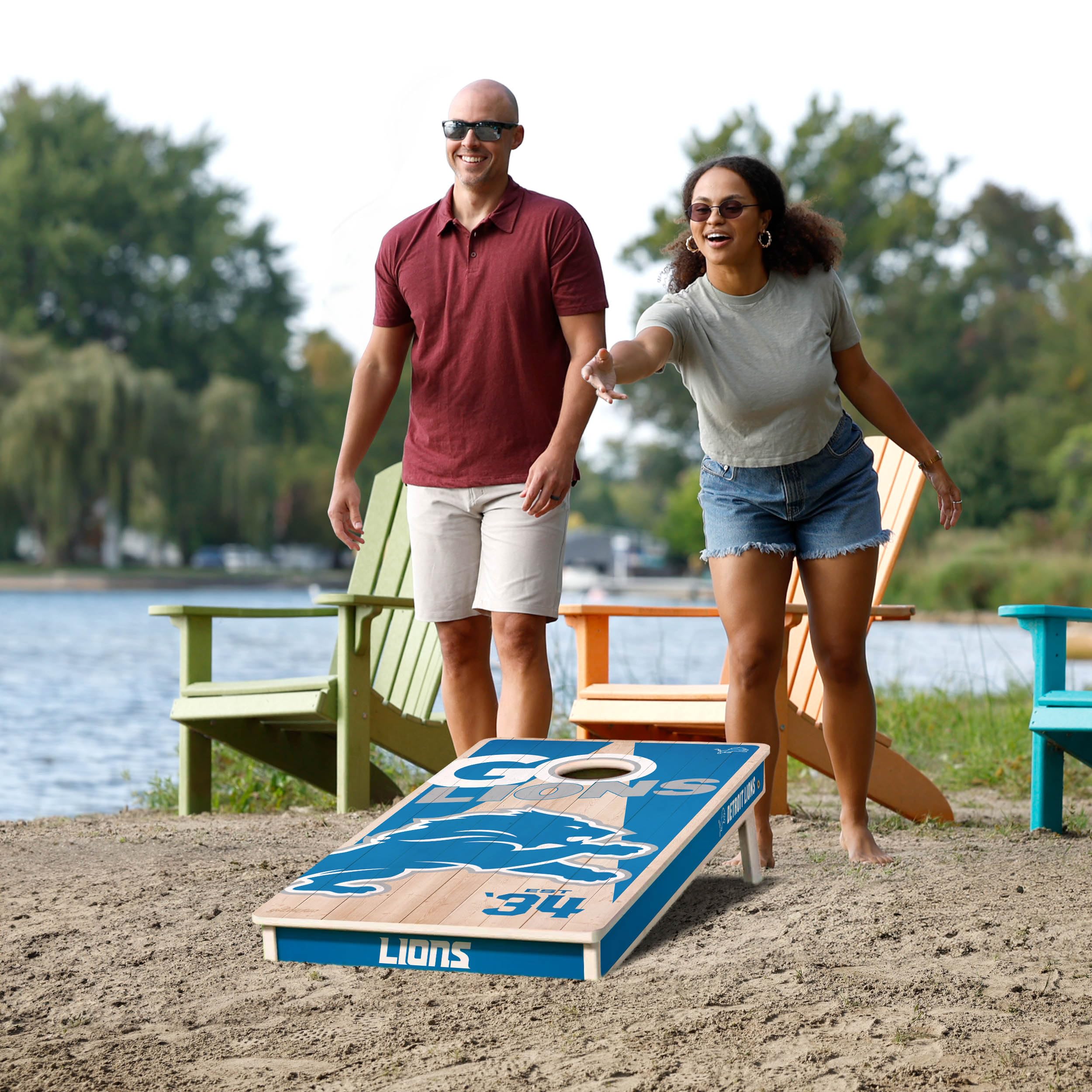 YouTheFan NFL Detroit Lions 2’ x 4’ Professional Wood Cornhole Game with Logo Bags - Sports Collectibles, Sports Memorabilia, Sports Fan Shop, Sports Gifts