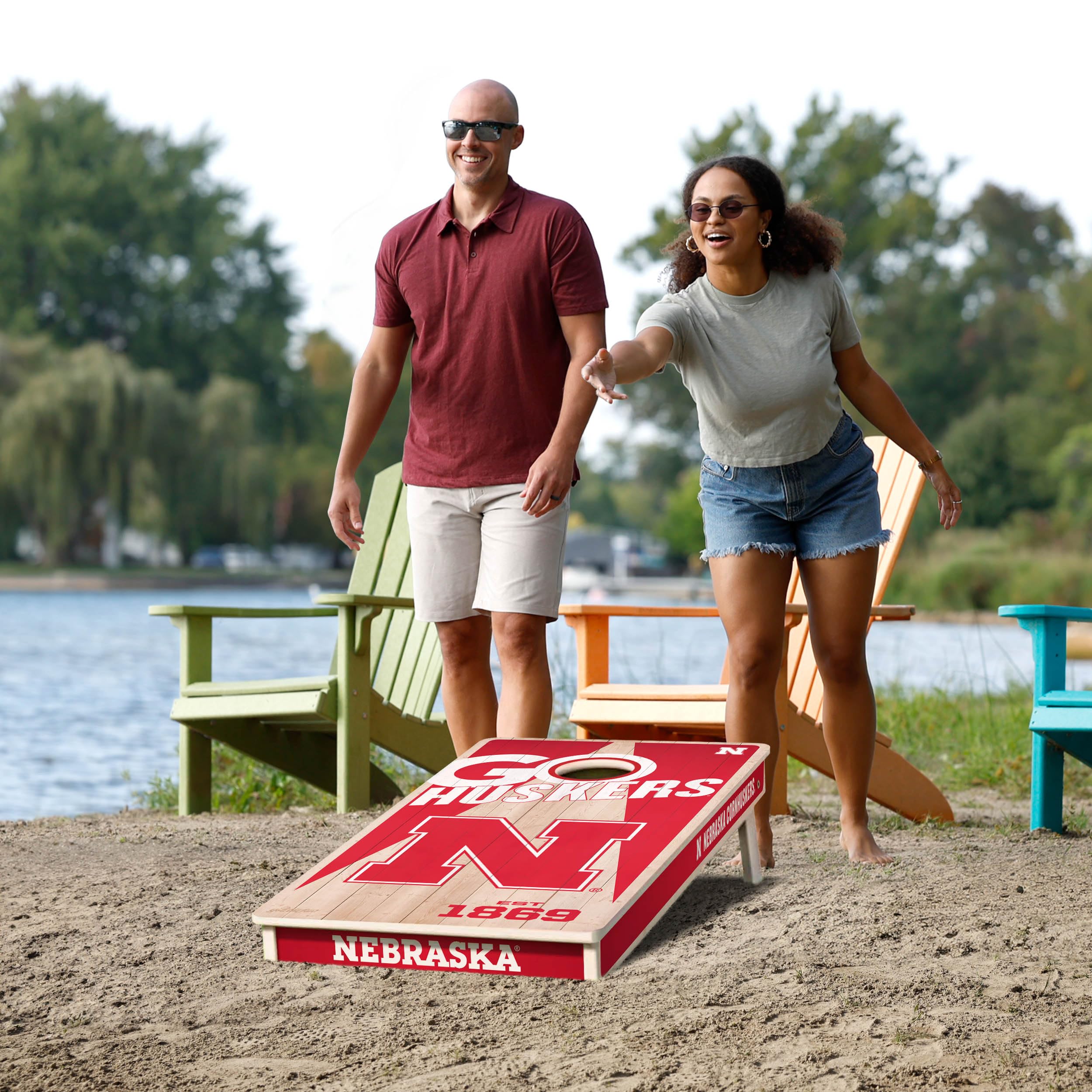 YouTheFan NCAA Nebraska Cornhuskers 2’ x 4’ Professional Wood Cornhole Game with Logo Bags - Sports Collectibles, Sports Memorabilia, Sports Fan Shop, Sports Gifts