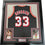 Framed Autographed/Signed Alonzo Mourning 35x39 Miami Black Basketball Jersey JSA COA