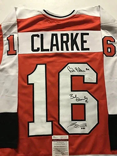 Autographed/Signed Reggie Leach, Bobby Clarke & Bill Barber Philadelphia Orange Hockey Jersey JSA COA